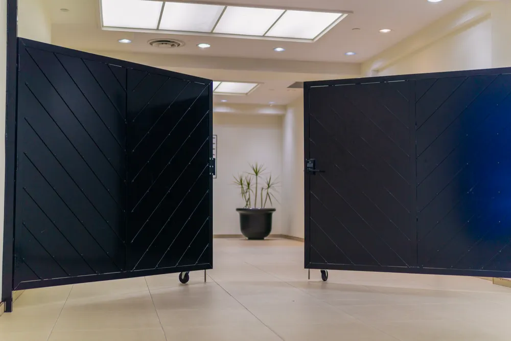 Black steel security gates in a commercial corridor