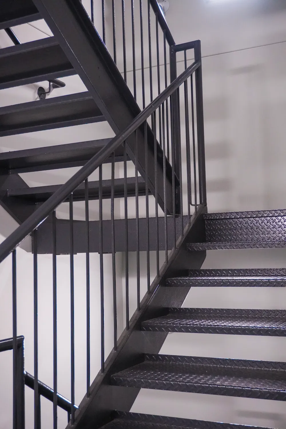 Commercial steel staircase with a code-compliant guardrail